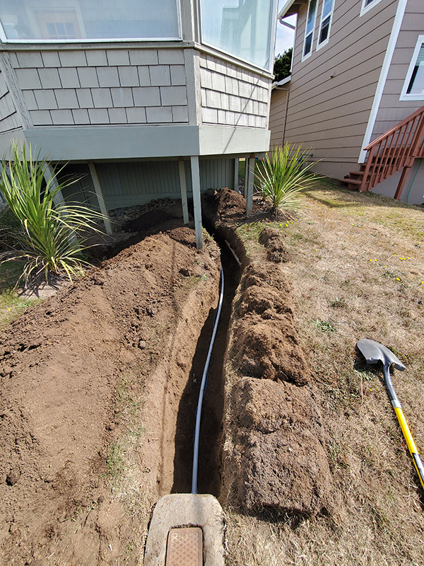 Replacing failed main water supply with new pipe and tracer wire.